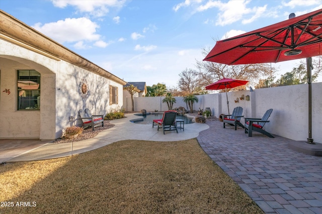 view of yard featuring a fenced in pool and a patio area