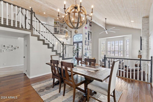 dining space with wood-type flooring, wood ceiling, ceiling fan with notable chandelier, and high vaulted ceiling