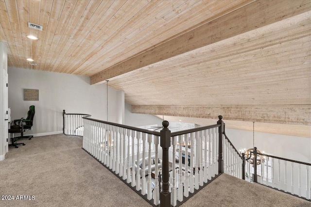 hallway with carpet floors, wood ceiling, lofted ceiling with beams, and a chandelier