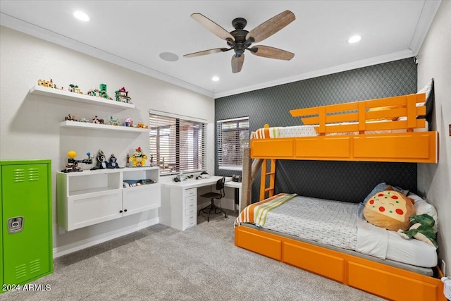 carpeted bedroom featuring ceiling fan and crown molding