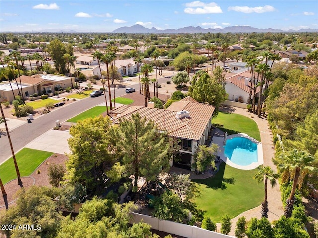 birds eye view of property with a mountain view