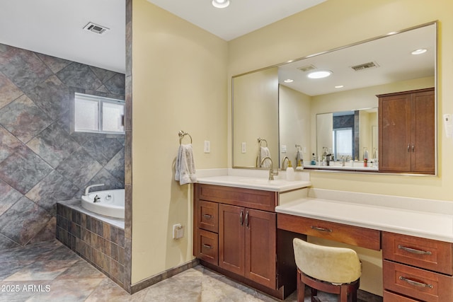 bathroom featuring recessed lighting, visible vents, a bath, and vanity