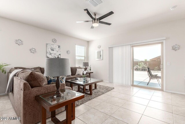 tiled living room with ceiling fan