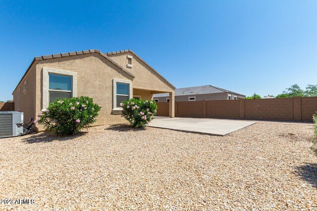 rear view of property featuring a patio area