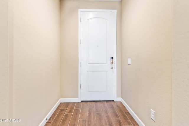 doorway to outside featuring wood-type flooring