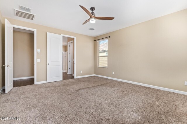 unfurnished bedroom featuring ceiling fan and carpet flooring