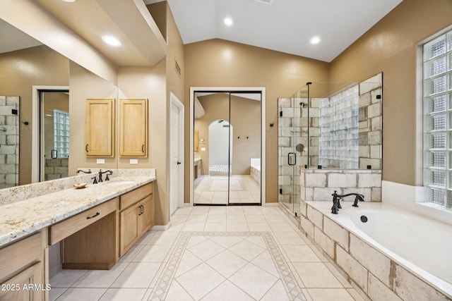 11816 E Terra Dr, Scottsdale, AZ 85259 - bathroom with a stall shower, a bath, tile patterned floors, vanity, and lofted ceiling