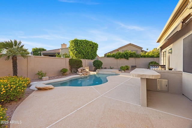 11816 E Terra Dr, Scottsdale, AZ 85259 - view of swimming pool featuring a fenced backyard, a patio area, and exterior kitchen