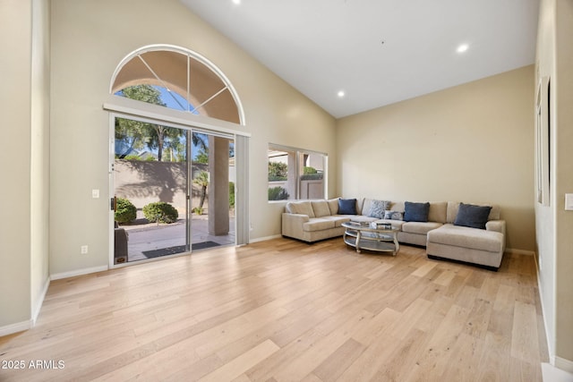 11816 E Terra Dr, Scottsdale, AZ 85259 - living room featuring light wood-style floors, recessed lighting, and high vaulted ceiling