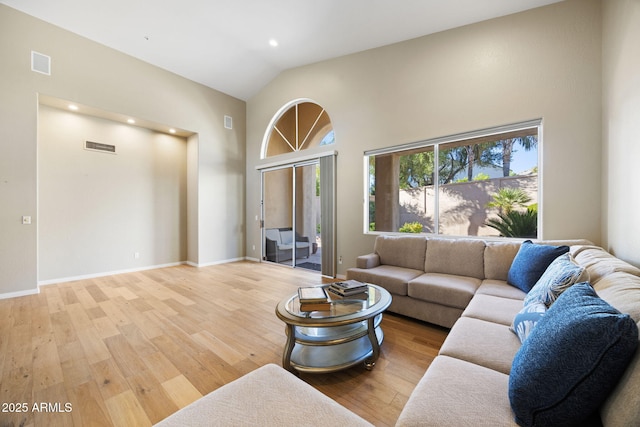 11816 E Terra Dr, Scottsdale, AZ 85259 - living room featuring high vaulted ceiling, wood finished floors, and recessed lighting