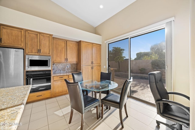11816 E Terra Dr, Scottsdale, AZ 85259 - dining room with light tile patterned floors, high vaulted ceiling, and recessed lighting
