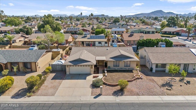 aerial view featuring a mountain view and a residential view