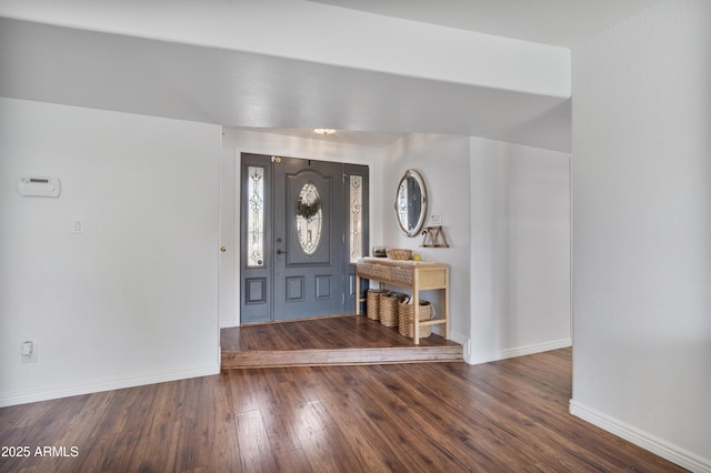 entryway with baseboards and wood-type flooring