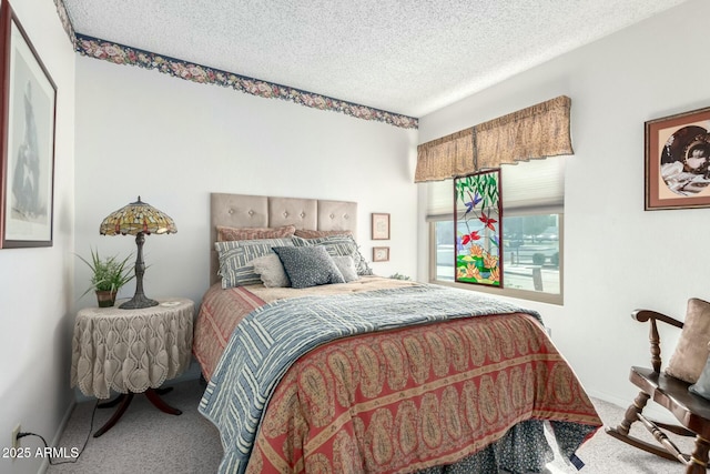 bedroom with carpet flooring and a textured ceiling