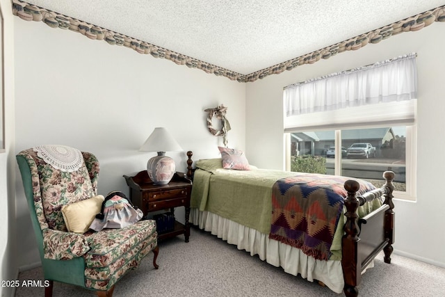carpeted bedroom featuring a textured ceiling