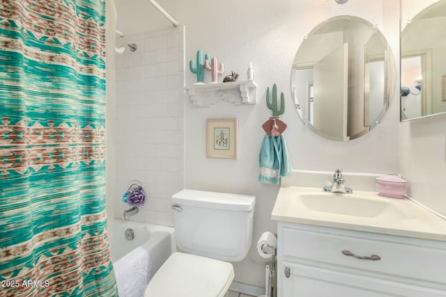 bathroom with vanity, toilet, and shower / bath combo with shower curtain