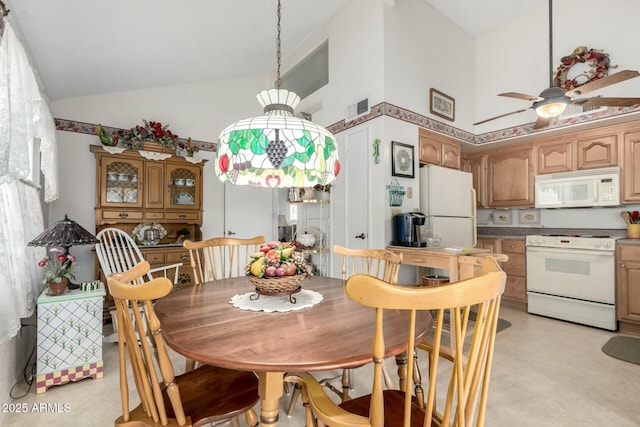 dining space with high vaulted ceiling, visible vents, light floors, and a ceiling fan