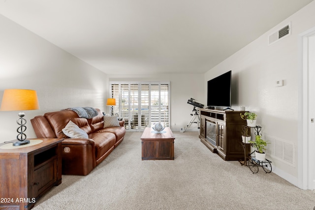 living room featuring light carpet