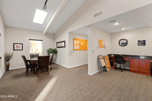 home office featuring lofted ceiling with beams and dark colored carpet