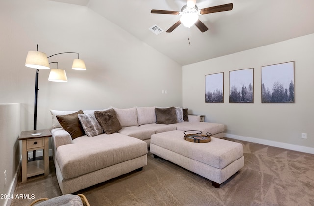 living room with lofted ceiling, ceiling fan, and carpet