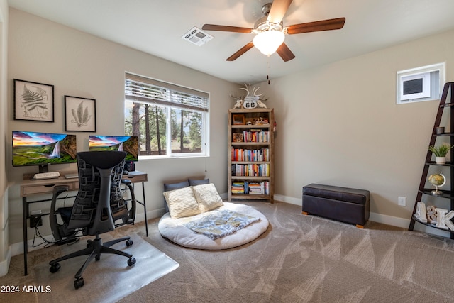 carpeted home office with ceiling fan