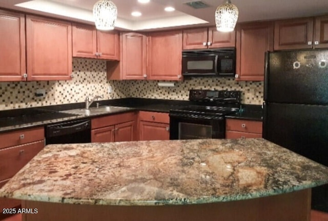 kitchen with black appliances, dark stone countertops, a sink, tasteful backsplash, and recessed lighting