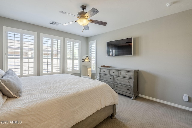 bedroom with a ceiling fan, light carpet, visible vents, and baseboards