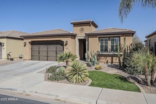 prairie-style house featuring driveway, an attached garage, a tiled roof, and stucco siding