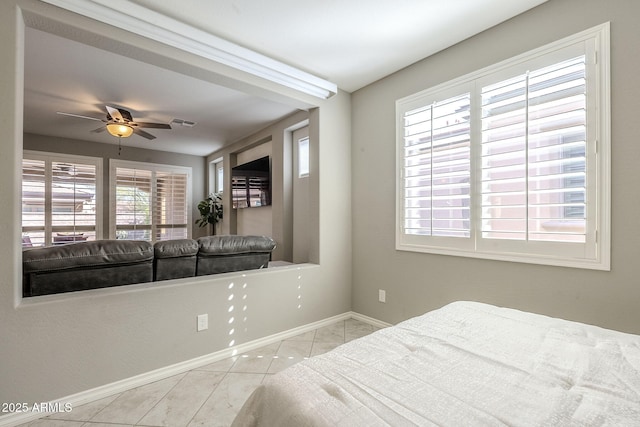 tiled bedroom featuring visible vents and baseboards