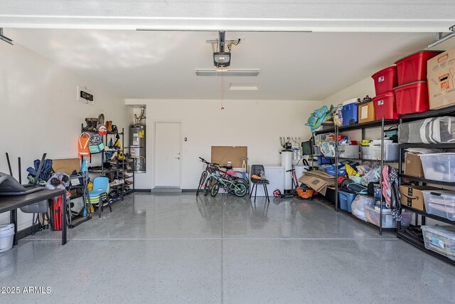 garage featuring a garage door opener and gas water heater