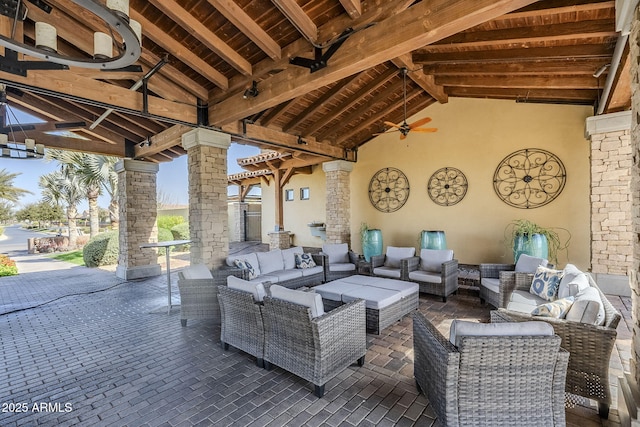 view of patio with outdoor lounge area and a ceiling fan