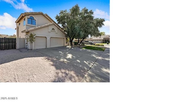 3761 W Kent Dr, Chandler, AZ 85226 - view of front of house with concrete driveway, a garage, fence, and stucco siding