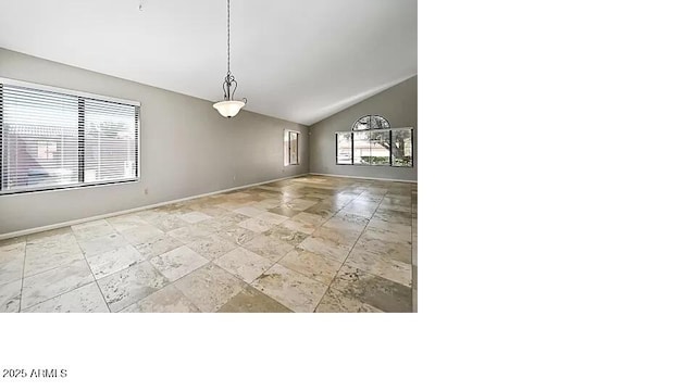 3761 W Kent Dr, Chandler, AZ 85226 - unfurnished dining area with baseboards, stone finish flooring, and vaulted ceiling