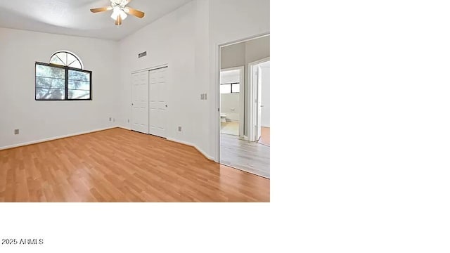 3761 W Kent Dr, Chandler, AZ 85226 - empty room featuring a towering ceiling, a ceiling fan, baseboards, and light wood-style floors
