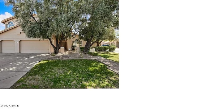 3761 W Kent Dr, Chandler, AZ 85226 - view of front of home with concrete driveway, a garage, a front yard, and stucco siding
