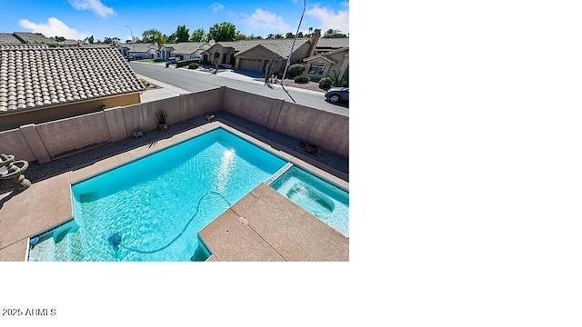 3761 W Kent Dr, Chandler, AZ 85226 - view of pool with a fenced backyard, a pool with connected hot tub, and a residential view