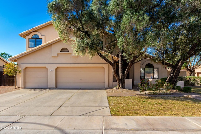3761 W Kent Dr, Chandler, AZ 85226 - view of front of house featuring an attached garage, driveway, a tile roof, and stucco siding
