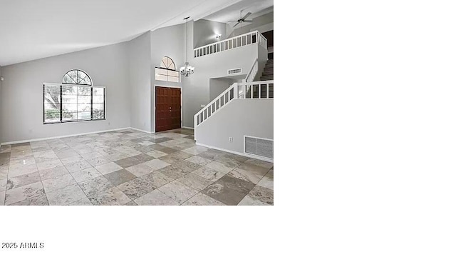 3761 W Kent Dr, Chandler, AZ 85226 - foyer entrance with high vaulted ceiling, stone tile floors, baseboards, visible vents, and stairway