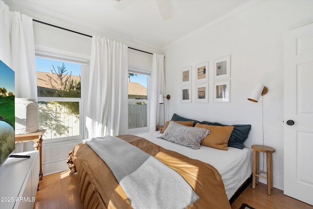 905 E Coronado Rd, Phoenix, AZ 85006 - bedroom featuring ornamental molding, wood finished floors, a ceiling fan, and access to outside