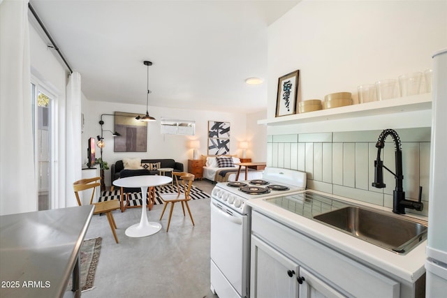 905 E Coronado Rd, Phoenix, AZ 85006 - kitchen with white electric range oven, a sink, open shelves, light countertops, and pendant lighting