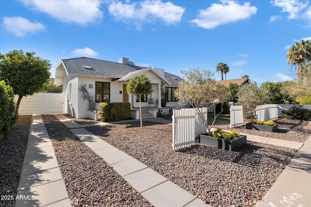 905 E Coronado Rd, Phoenix, AZ 85006 - bungalow-style home with a vegetable garden, stucco siding, roof with shingles, and a gate
