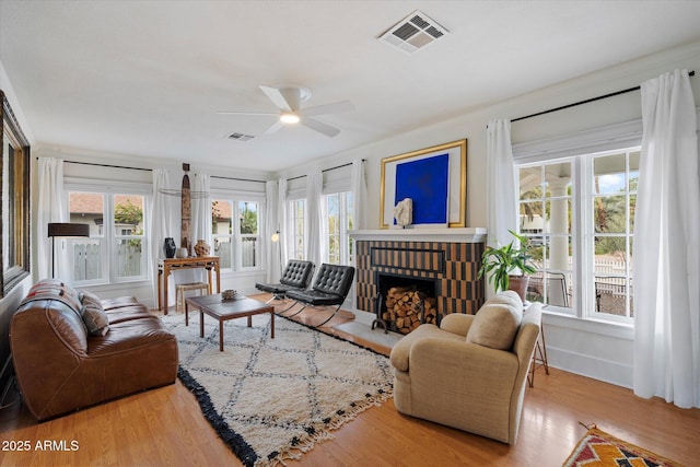 905 E Coronado Rd, Phoenix, AZ 85006 - living room with a ceiling fan, a brick fireplace, wood finished floors, and baseboards