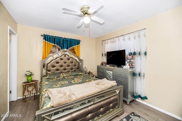 bedroom featuring ceiling fan and hardwood / wood-style flooring