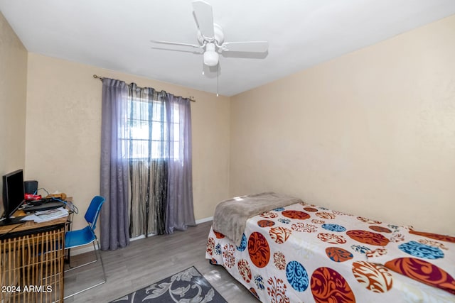 bedroom featuring ceiling fan and hardwood / wood-style flooring