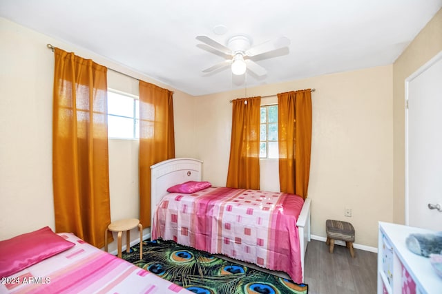 bedroom with wood-type flooring and ceiling fan