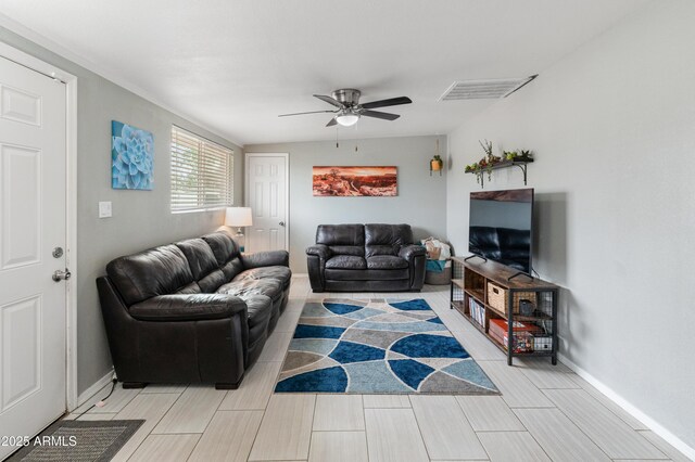 3806 N 64th Dr, Phoenix, AZ 85033 - living room featuring ceiling fan and baseboards
