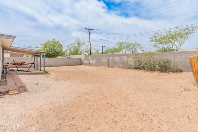 3806 N 64th Dr, Phoenix, AZ 85033 - fenced backyard featuring a patio