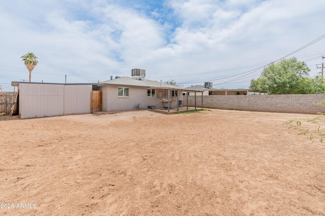 3806 N 64th Dr, Phoenix, AZ 85033 - back of house featuring a fenced backyard, central air condition unit, and a patio area