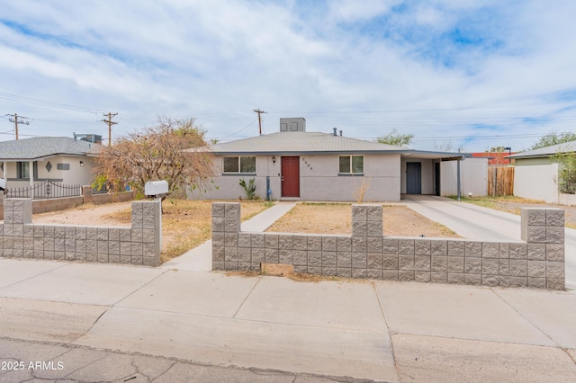 3806 N 64th Dr, Phoenix, AZ 85033 - ranch-style house with driveway, a carport, and stucco siding