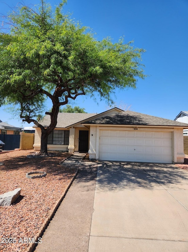 3329 W Ross Ave W, Phoenix, AZ 85027 - ranch-style house with concrete driveway and an attached garage